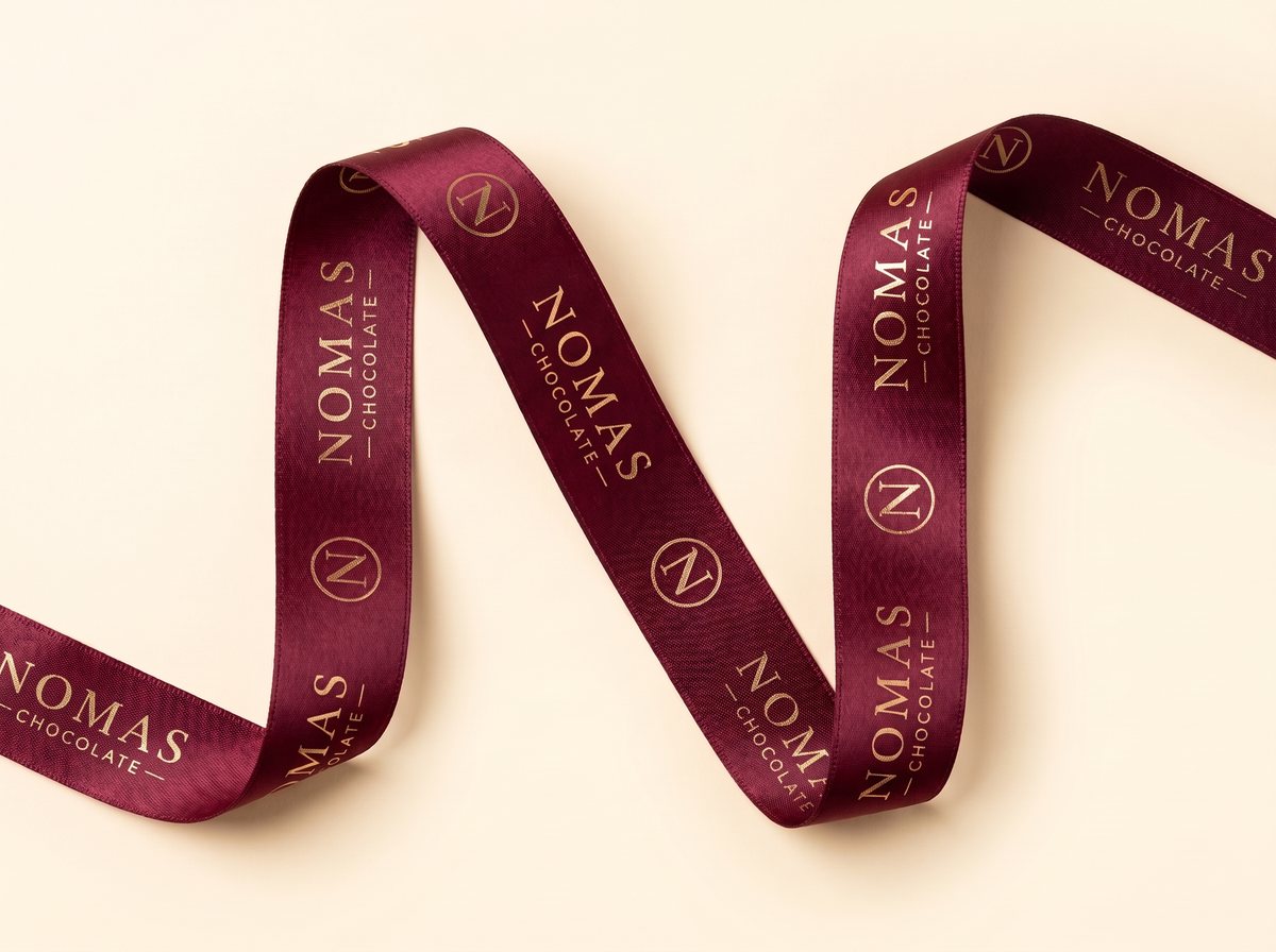 The burgundy Nomas ribbon